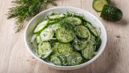 Obraz premium Fresh Cucumber and Onion Salad with Dill in Creamy Dressing, top view