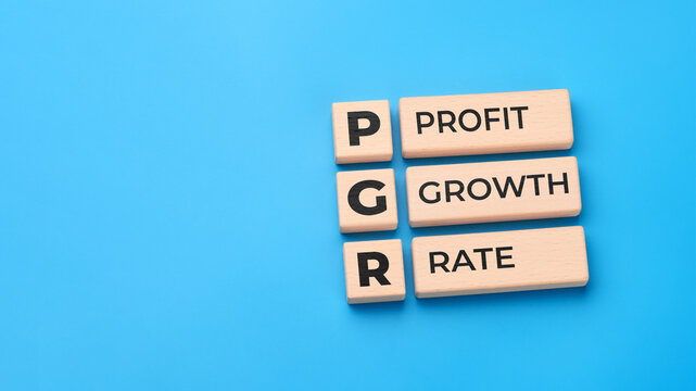 Profit growth rate concept with wooden blocks and PGR abbreviation