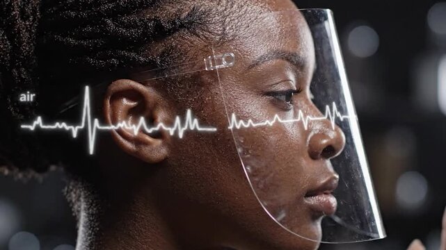 Woman in Face Shield with Glowing Heart Rate Waveform Pulse