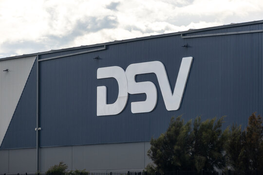 DSV logo displayed on the exterior of a large industrial warehouse building in Melbourne, Australia. It is a Danish transport and logistics company offering global transport services
