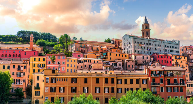 scenic cityscape of beautiful italian town Ventimiglia on a France boundary with picturesque buildings, churches and towers and beautiful cloudy sky on background of landscape