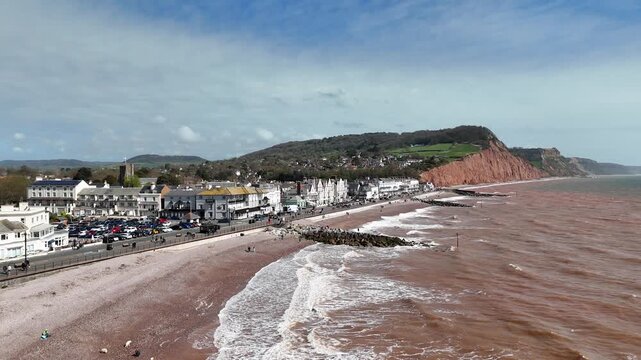 Panning drone aerial Sea front Sidmouth Devon coastal town UK