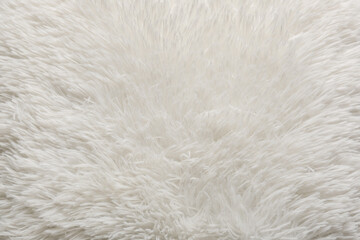 Fototapeta premium Texture of beige fluffy carpet as background