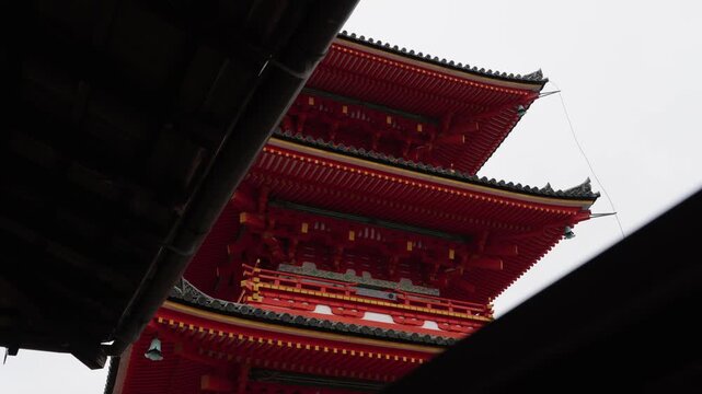 Low angle view of traditional red pagoda at Kiyomizu dera temple Kyoto Japan
