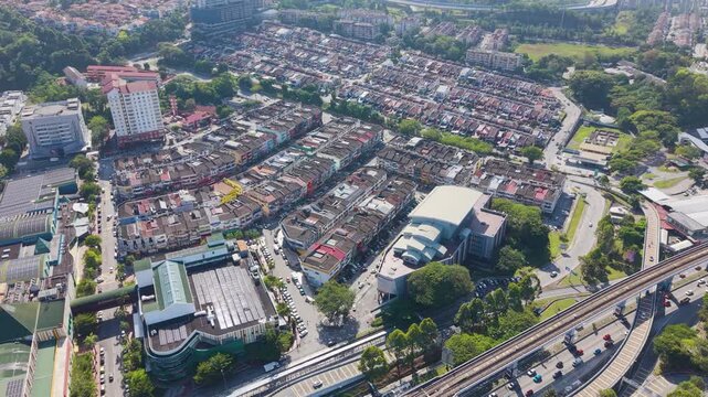 Drone shot of traffic and MRT train near Taman Segar in Cheras, Kuala Lumpur, showing urban infrastructure, city movement, and modern transportation systems. UHD.