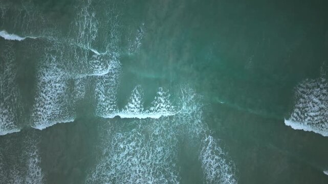 Waves breaking on a shoreline in Cape Town, South Africa