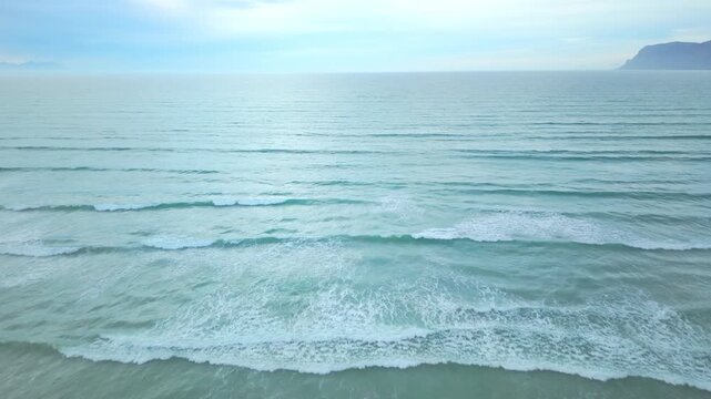 Waves roll into a shoreline.
Muizenberg, Cape Town