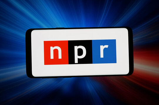 Stuttgart, Germany - 04-08-2026: In this photo illustration, the logo of US organisation National Public Radio (NPR) is displayed on a smartphone in front of abstract background on computer screen.