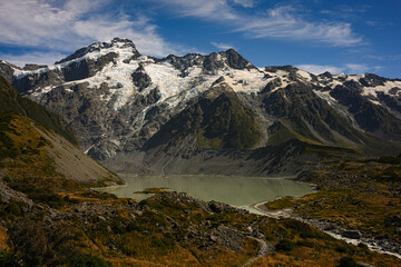 Obraz premium Snow covered mountain range under blue sky, New Zealand Alps