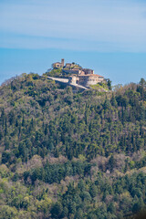 Fototapeta premium Medieval castle ruins on rocky hilltop, Torriana Scorticata Valmarecchia landscape, Rimini Emilia Romagna Italy, historic fortress architecture, scenic countryside view