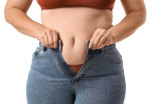 Overweight woman in tight jeans on white background, closeup