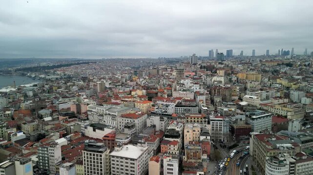 the Galata Tower, business part of the city in the background fly forward shot