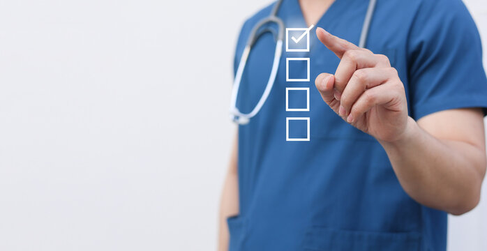 close up young general practitioner hand use stylus pen to check box on medical chekclist or opd record to read and diagnose and assess about patient's symptom for healthy and lifestyle concept