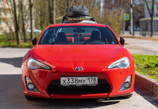 Red Japanese sport car Toyota GT86 GR Sport at the city street. Exterior of a fast Japanese two-door coupe Toyota GT 86 2.0 GR Sport  on parking lot. JDM cars. Japanese sport coupe in parking lot. 