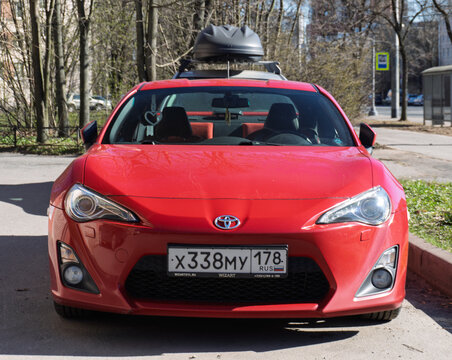 Red Japanese sport car Toyota GT86 GR Sport at the city street. Exterior of a fast Japanese two-door coupe Toyota GT 86 2.0 GR Sport  on parking lot. JDM cars. Japanese sport coupe in parking lot. 