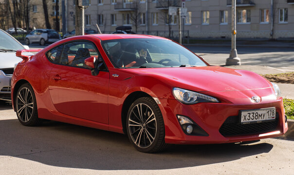 Red Japanese sport car Toyota GT86 GR Sport at the city street. Exterior of a fast Japanese two-door coupe Toyota GT 86 2.0 GR Sport  on parking lot. JDM cars. Japanese sport coupe in parking lot. 