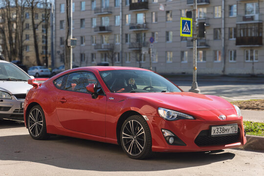 Red Japanese sport car Toyota GT86 GR Sport at the city street. Exterior of a fast Japanese two-door coupe Toyota GT 86 2.0 GR Sport  on parking lot. JDM cars. Japanese sport coupe in parking lot. 