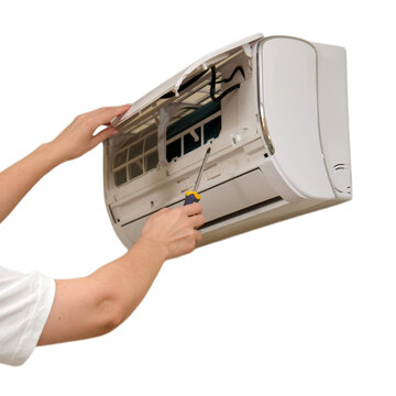 Technician repairing air conditioner with screwdriver on transparent background. Professional maintenance service of home climate control system. HVAC cooling unit cleaning and repair concept.