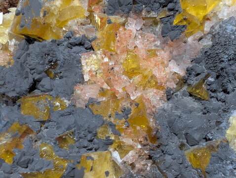 Golden Calcite and Dark Sulfide Cluster