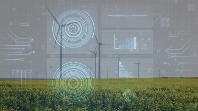 As faint grid overlay appearing, wind turbines showing rotating blades, HUD aligning to monitor