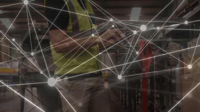 Warehouse man walking aisle tapping tablet, activating network overlay updating inventory counts