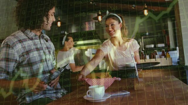 Server serving order by placing basket on cup as customer gesturing tablet, sales graphs overlaying