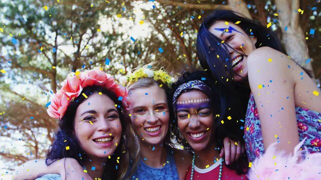 Four women pressing heads together for selfie under trees sparking event confetti falling on faces