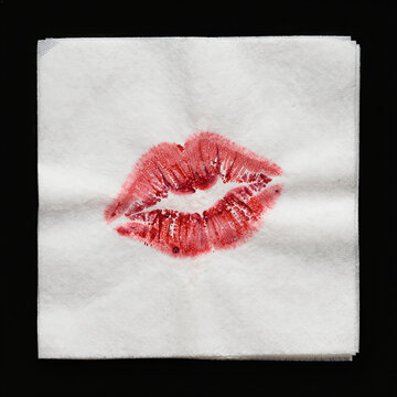 Vibrant Red Lipstick Kiss Mark on White Napkin