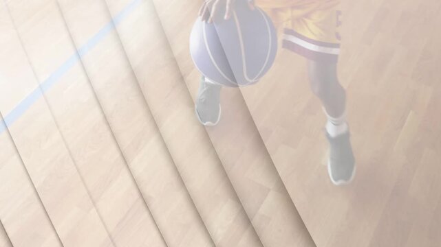 Male teen starting right bounce dribbling ball footwork on sports court striped overlay for drill