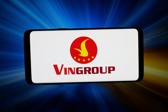 Stuttgart, Germany - 04-09-2026: In this photo illustration, the logo of Vietnamese conglomerate company Vingroup JSC is displayed on a smartphone in front of abstract background on computer screen.