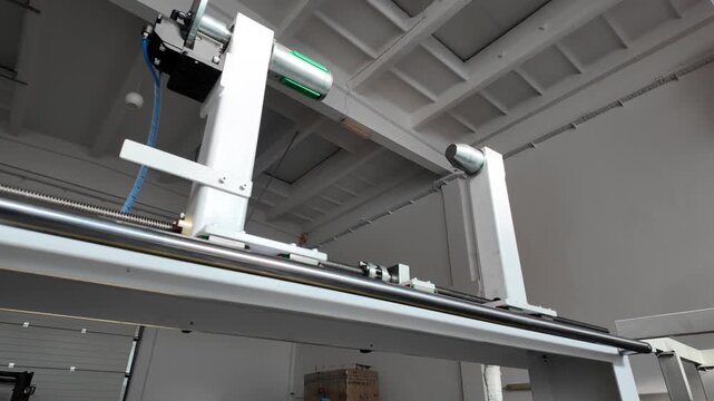 Low Angle View of Automated Industrial Winding Machine in White Factory