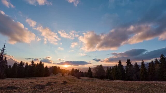 Spring Sunset Over Mountain Forest and Meadow Landscape Timelapse