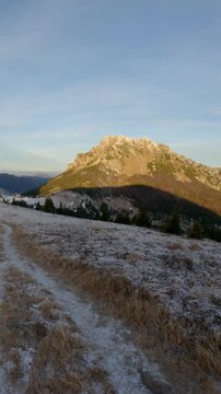 Vertical POV Walking on Frosty Mountain Ridge Toward Peak