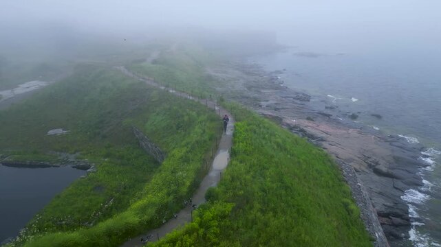 Aerial view of Suomenlinna during a foggy rainy day, man walking and enjoying the quiet surroundings