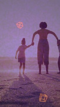 Vertical video: Mom guiding kids on sand lifting arms urging jumping orange icons moving for travel