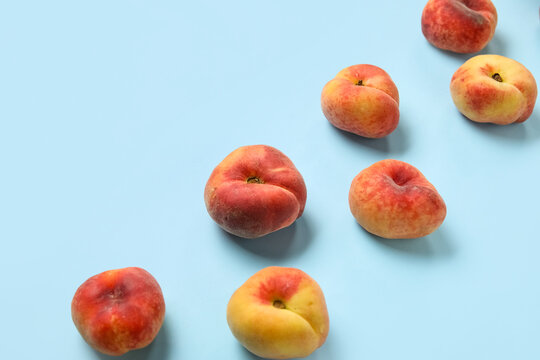 Sweet fig peaches on blue background