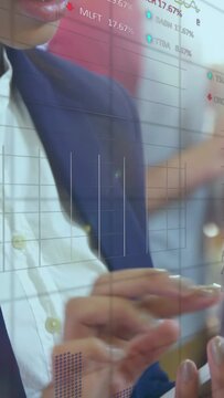 Vertical video: Woman tapping phone, showing finance charts tracking stocks, reviewing market