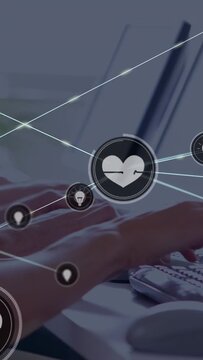 Vertical video: Hands typing on keys causing health HUD expanding nodes and ECG lines tracking data