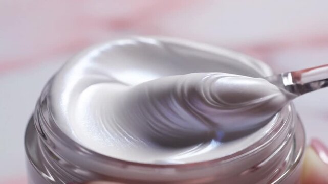 Shimmering white gel in clear jar with applicator