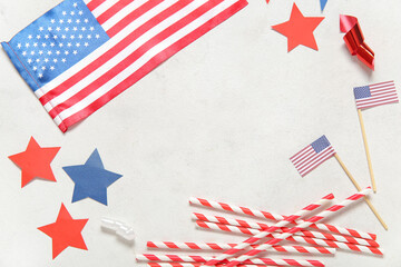 Obraz premium Frame made of USA flags, straws and stars on grey grunge background. Independence Day celebration