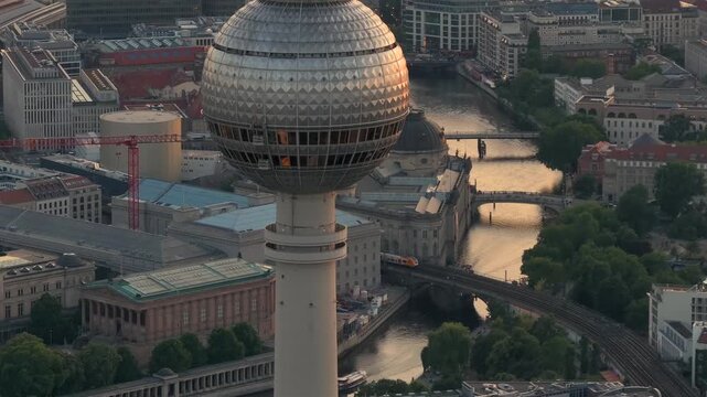 Berlin TV Tower Close up Aerial View with Amazing Soft Sunset Light. Alexanderplatz Fernsehturm in Berlin City Center.