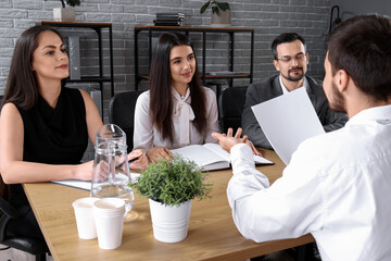 Human resources commission interviewing male applicant in office