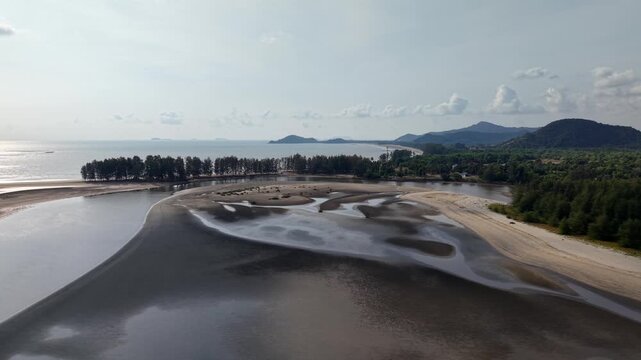 Drifting tide pools reflect sky's soft hues