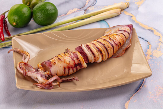 Tasty grilled wild squid with lime