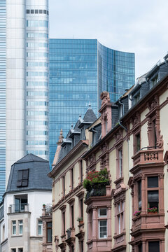 Urban architecture in Frankfurt city captures a street view where historic facade meets modern skyscraper shaping a changing skyline