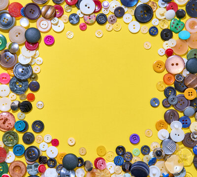 Colorful button border frame with copy space on yellow background
