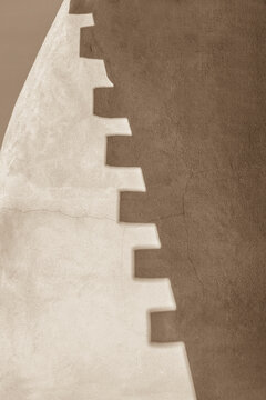 Minimal abstract shadow pattern on textured wall modern neutral background