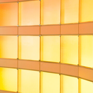 Abstract yellow glass wall panels modern architectural background texture