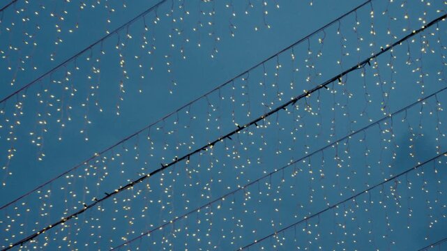 Blue solar panels on a roof create a modern textured pattern design with a metal backdrop for a winter wallpaper illustration