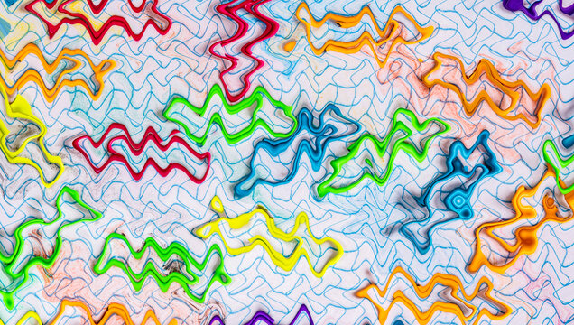 Clips de colores variados sobre una libreta con hojas cuadriculadas, creado con Photoshop.